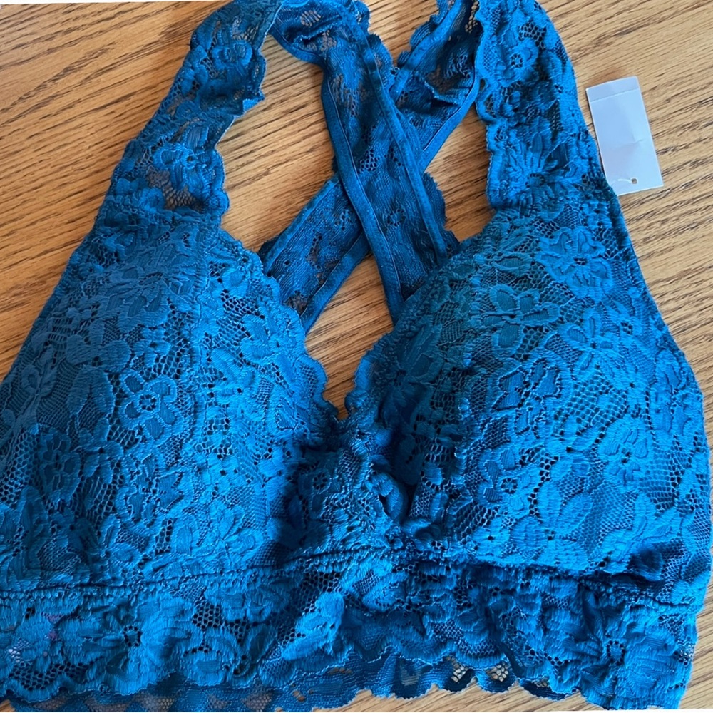 Teal flowered lace cross back lightly padded size XL.